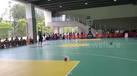 Impressive long-distance basketball throw during teachers’ sports competition in Guangdong, China