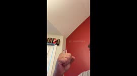 Man demonstrates laser pointer's power by lighting matches in his hand