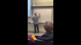 Teacher carries dog while teaching in Shanghai, China
