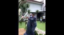 Bride falls after bouquet toss at Bandung wedding in West Java, Indonesia