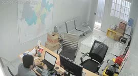 Office ceiling collapses from pooled water as man lights cigarette