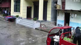 Young girl accidentally starts motorised tricycle and crashes into ping pong table