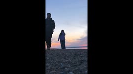 Wild fox snatches couple’s phone as they pose at a lake