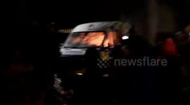 Police van set alight amid anger at 'sex abuse migrant' staying in hotel