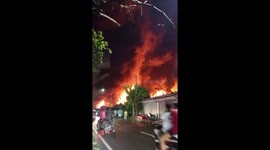 Fire crews battle blaze at oil waste facility in Indonesia