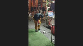 Coconut Tossing Show Mishap at Jonker Walk as Vendor Misses Catch