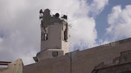 Palestinians gather amidst rubble of Al-Nasr Mosque for Friday prayers