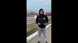 Guy Stands Close To Burning Car