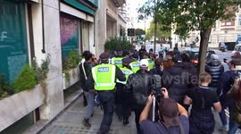 Police Intervene as UKIP Protesters Pursue Masked Individual in London