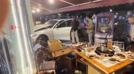 BMW spins out of control and crashes into restaurant in China