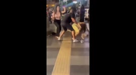 Tourist who wrestled a ladyboy to the ground attacked by dozens of her friends.