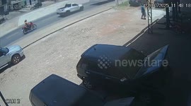 Strong gust of wind blows woman off her motorcycle in Brazil