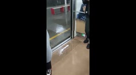 Water enters train during rush hour in Indonesia