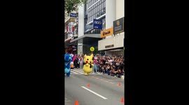 Cartoon character mascots have hilarious race along road