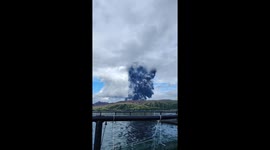Fishermen panic as volcano erupts behind them