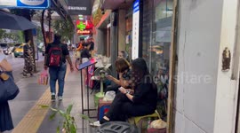 Thai strippers wear black dresses in show of grief for country's queen mother