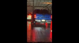 Man Hangs From Back of Moving Corvette