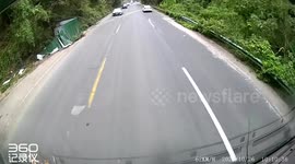 Motorcycle thrown off cliff during risky overtake in Guizhou, China