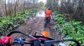 Motorcyclist loses balance on muddy forest road in Saint Petersburg, Russia