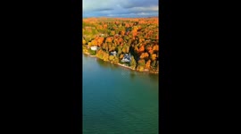 Serene autumn reflections in Alden, Michigan, USA,