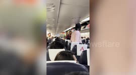 Chaos as rowdy passenger is dragged off flight by security after disrupting takeoff