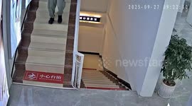 Man trips and falls down stairs in Yunnan, China