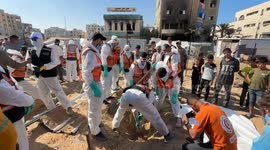 Bodies of 80 Palestinians reburied in central Gaza (3)
