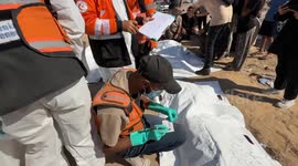 Bodies of 80 Palestinians reburied in central Gaza (4)