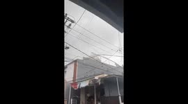 Roof torn from home by violent storm lashing Indonesia