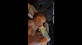 Bottle Boy Holds Bottle With His Feet