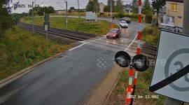 Car wheel falls off leaving woman stranded on level crossing with train approaching