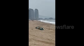 SUV Gets Stuck and Submerged After Illegally Driving on Beach in Huizhou, China