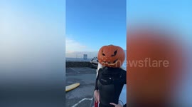 Watch three women surfing with pumpkins on their heads for Halloween