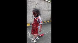 Toddler wears truly terrifying Ed Gein Halloween outfit... complete with 'mother's face' sewn on