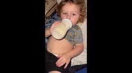 Baby rubs and pats belly after eating Oreos