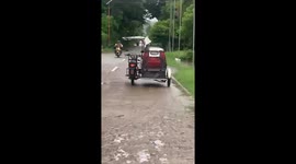 Motorcycle sidecar appears to be 'ghost rider' as it cruises along road
