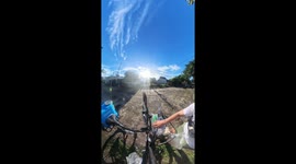 Kind cyclist feeds stray animals in the Philippines