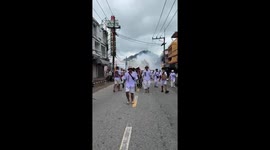 Devotee has cheeks pierced with bamboo poles at vegetarian festival in Thailand