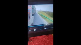 Cyclist narrowly avoids falling under the wheels of truck