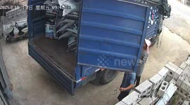 Pile of cargo falls and slams truck door inches from woman’s head