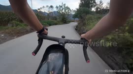 Bicycle rider loses control on narrow road in Hubei, China