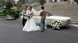 A Wedding Cople poses for photographs at the Reunification Palace in Ho Chi Minh City, Vietnam