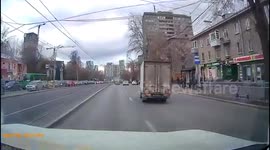 Motorcycle rider crashes into the back of car in Russia