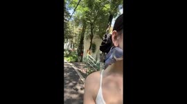 Parrot naps inside owner's loop earring