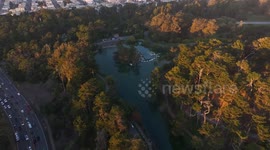 Golden Gate Bridge and San Francisco skyline glow at sunset