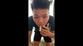 Man falls from hammock into muddy field in Ho Chi Minh, Vietnam