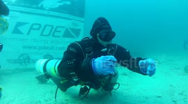 Eating hard boiled egg under water