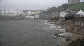 humans and nature struggling to survive the wind and high tides plymouth devon uk