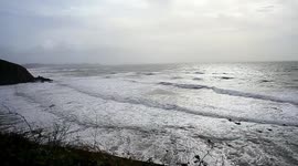 The Storm of St Judes was brewing  and people still entering the sea to surf