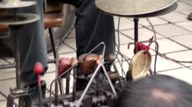 The blind man street play music at passers-by with hands and feet